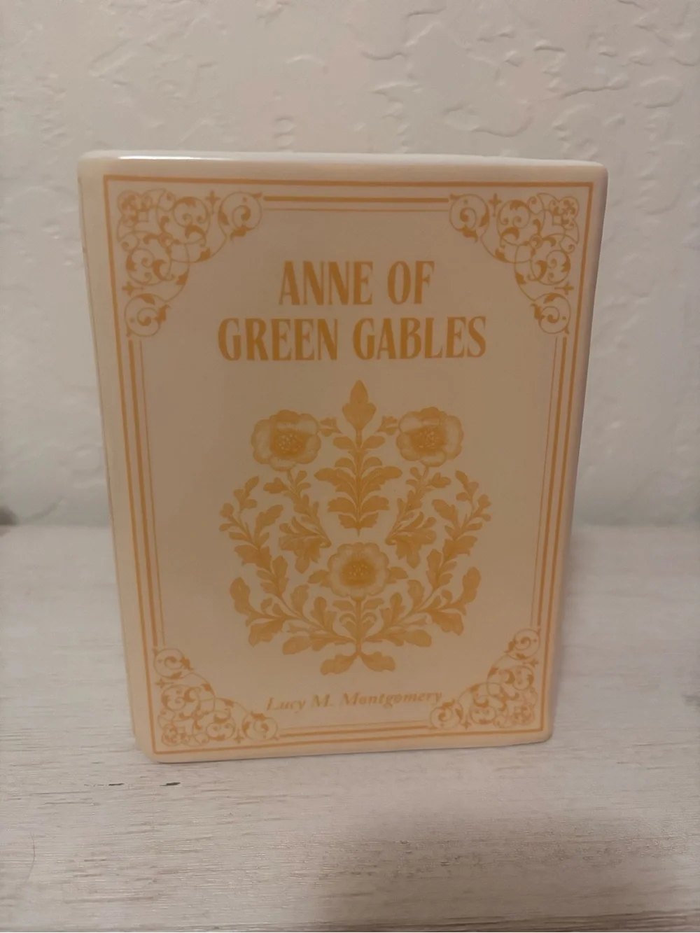 Anne of Green Gables book vase. ceramic book vase with vertical ribbed texture.